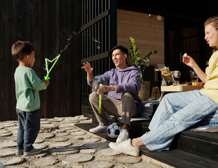 Three people relaxing together outdoors